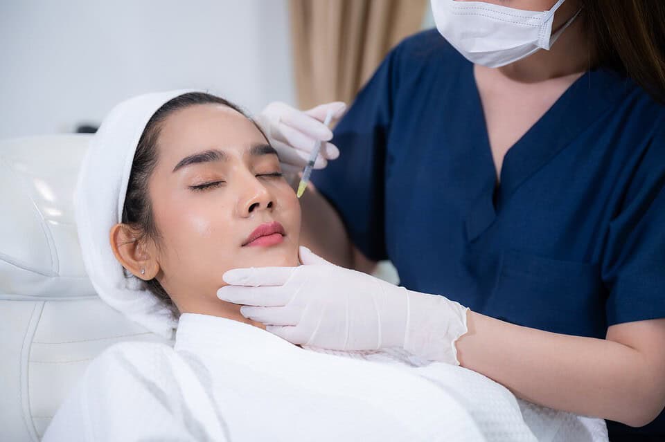 A woman getting Rejuran injections for her face