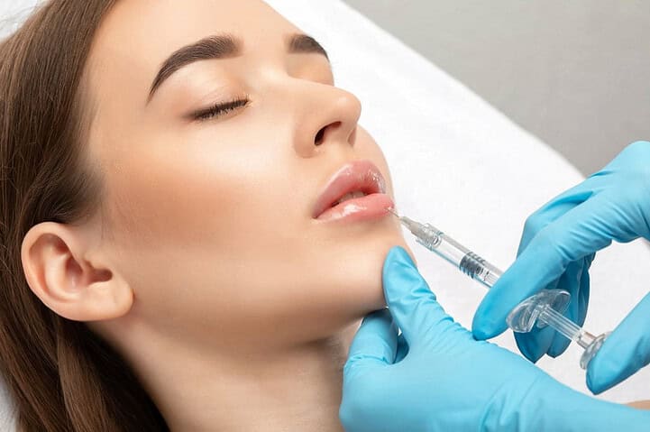 A patient having a lip filler injection at Nirunda Clinic