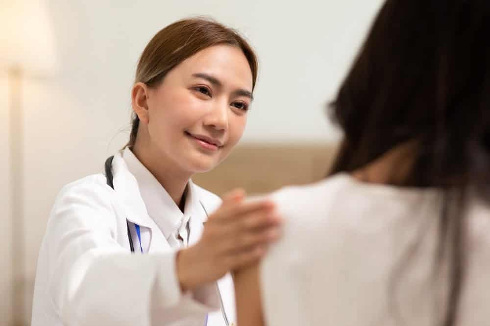 A doctor giving a patient gender reassignment consultation