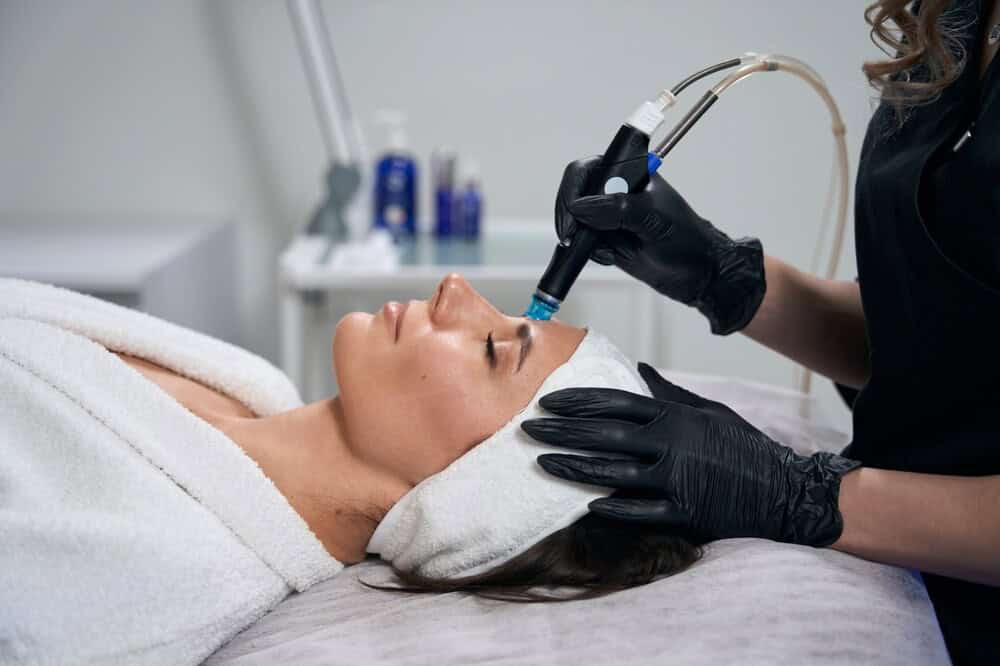 Beautician doing facial skin rejuvenation