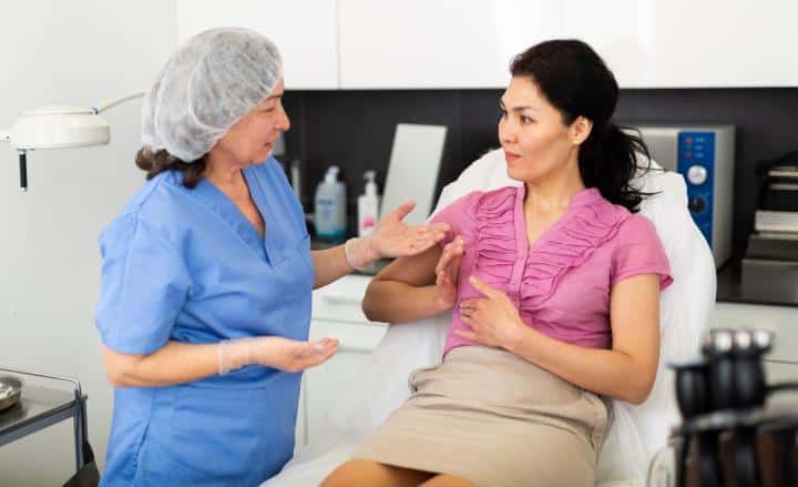 A woman consulting a surgeon about a labiaplasty