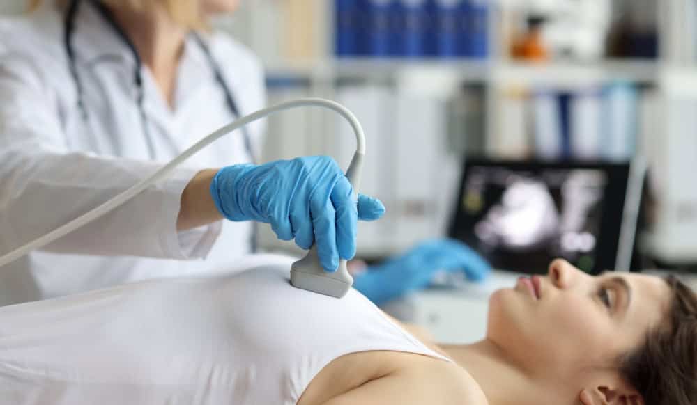 A lady going through a checkup before breast augmentation