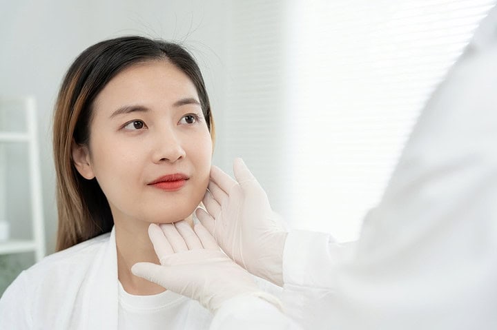 A woman consults with a doctor about a facial filler at aesthetic clinic in Bangkok