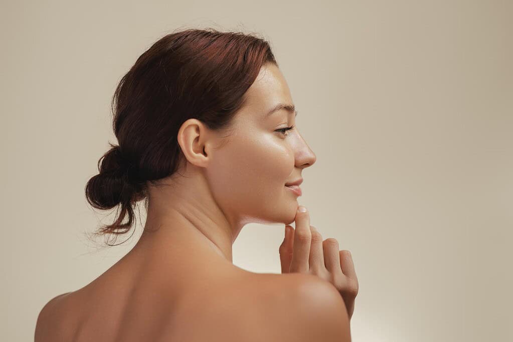 Side profile of model, showing chin filler result