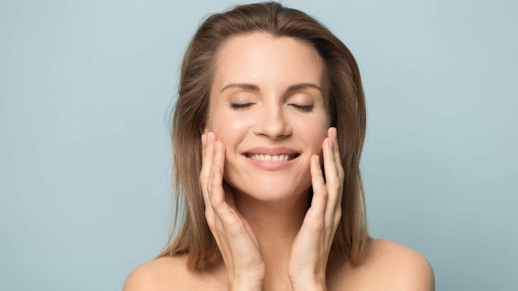 A smiling woman after a Belotero Revive treatment

