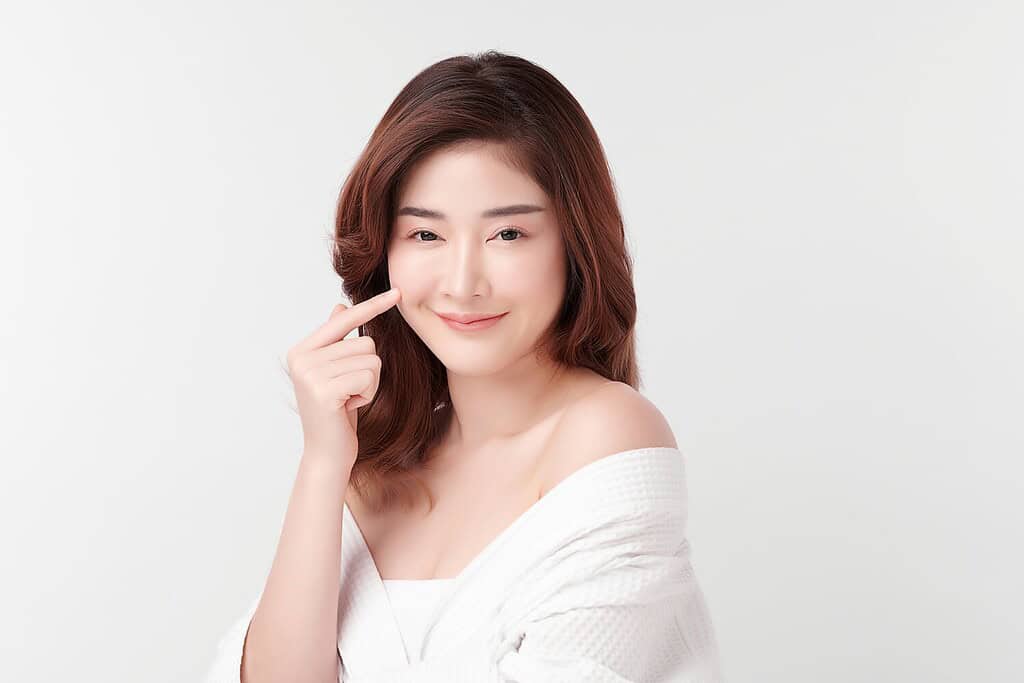 A woman happy with the results of her Juvelook skin booster treatment