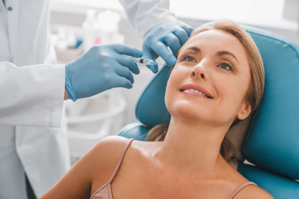 A woman receiving an injection treatment for wrinkles