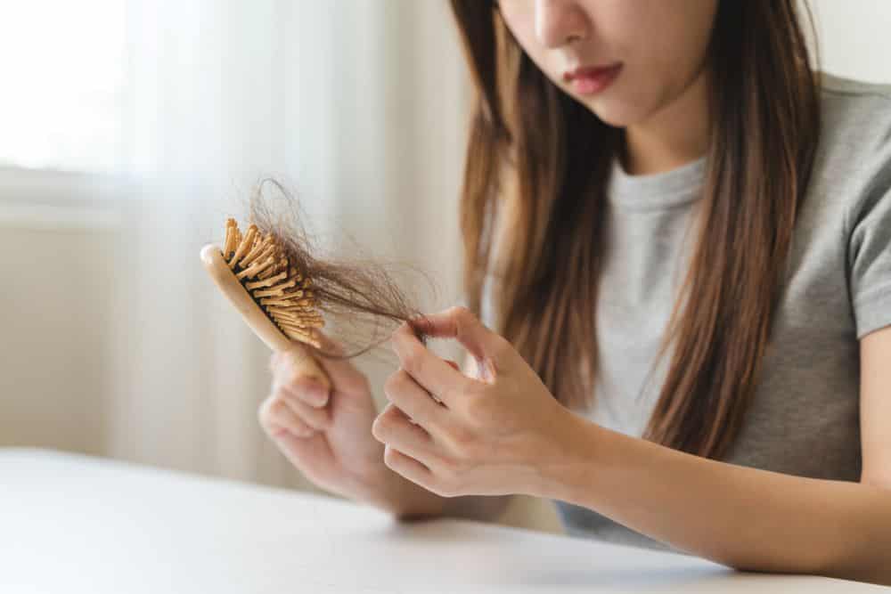 A woman faces the reality of hair loss