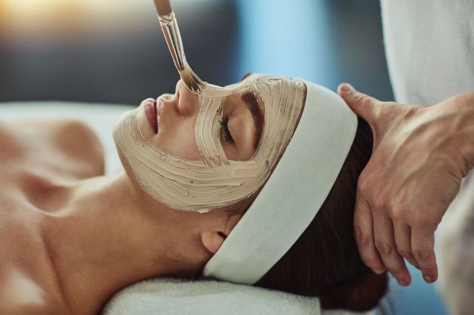 A woman has a rejuvenating facial treatment in Bangkok