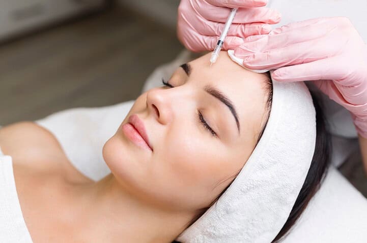 Administering treatment to find which looks more natural, Botox or Dysport, for the patient