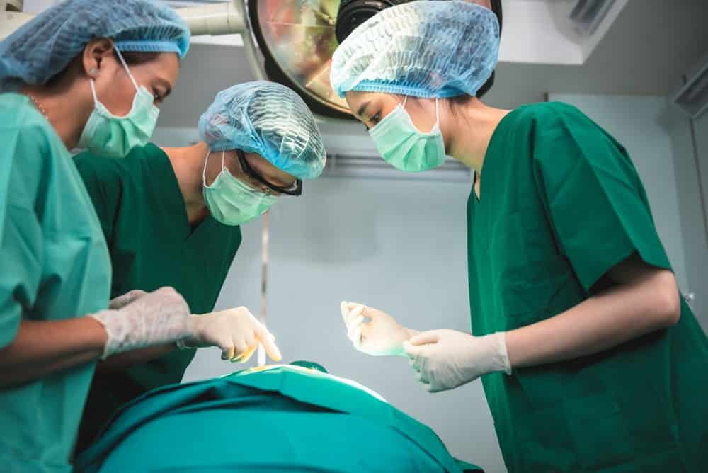 A surgeon team carrying out one of the phalloplasty procedure stages at a clinic in Bangkok.