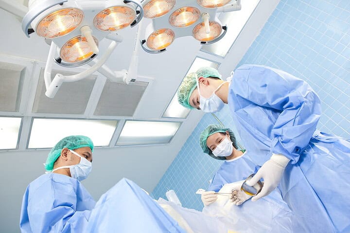 A team of surgeons carrying out a phalloplasty procedure for a patient in Thailand