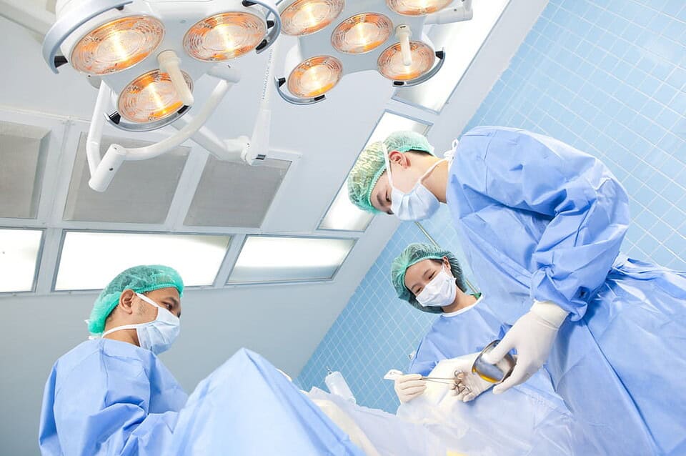 A team of surgeons carrying out a phalloplasty procedure for a patient in Thailand