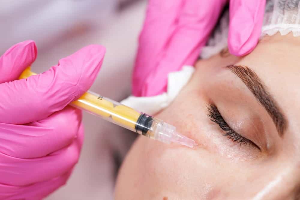 Close-up of an under-eye injection treatment for sunken eyes at an aesthetic clinic