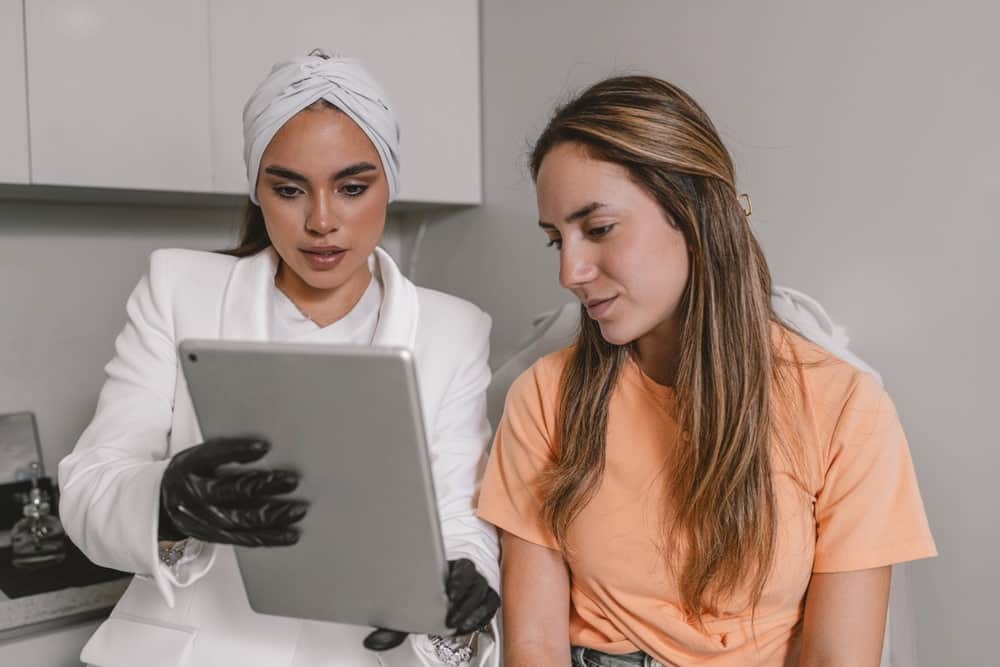 Female patient discussing Botox aftercare with her doctor during a consultation